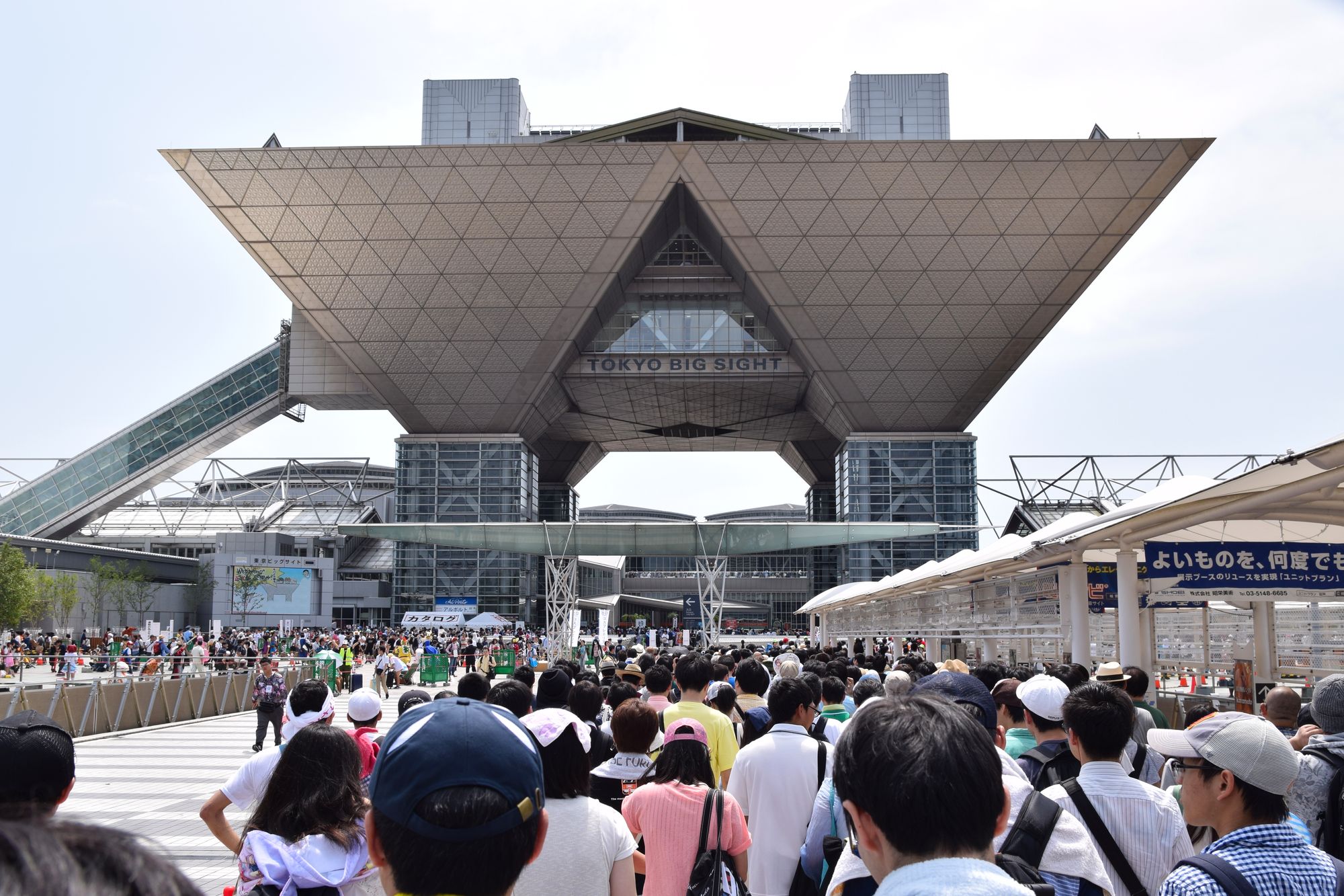 A group of people heading towards a large building.